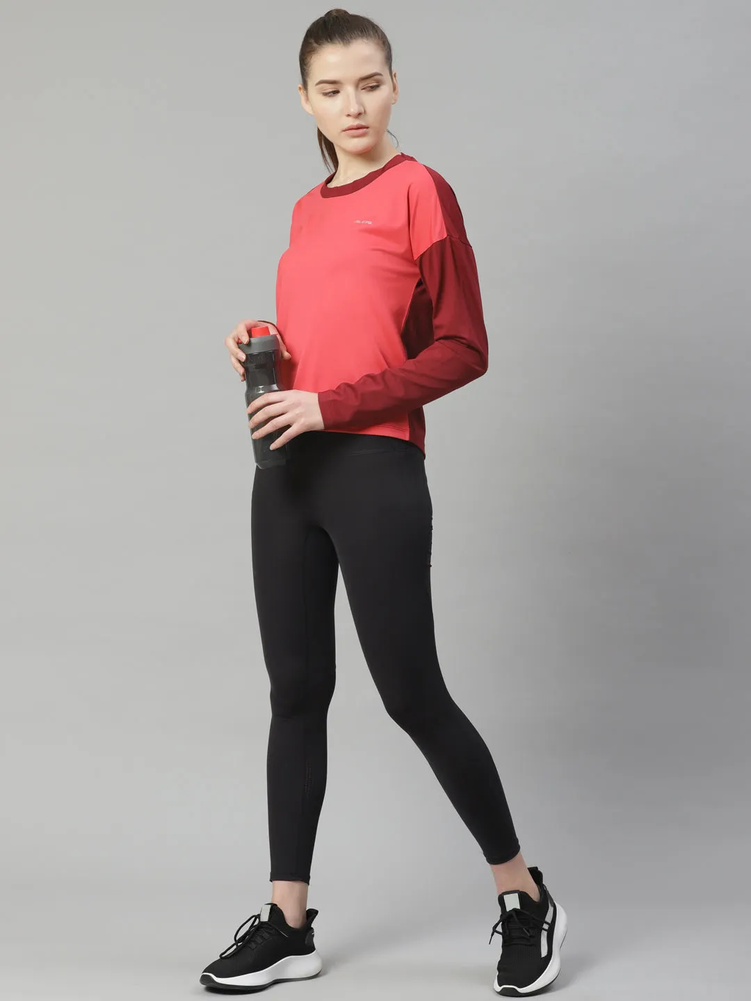 Alcis Women Coral Pink Solid Slim Fit Round Neck T-shirt